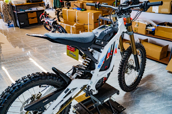 SURRON Light Bee X 2026 electric dirt bike in white, front angle view