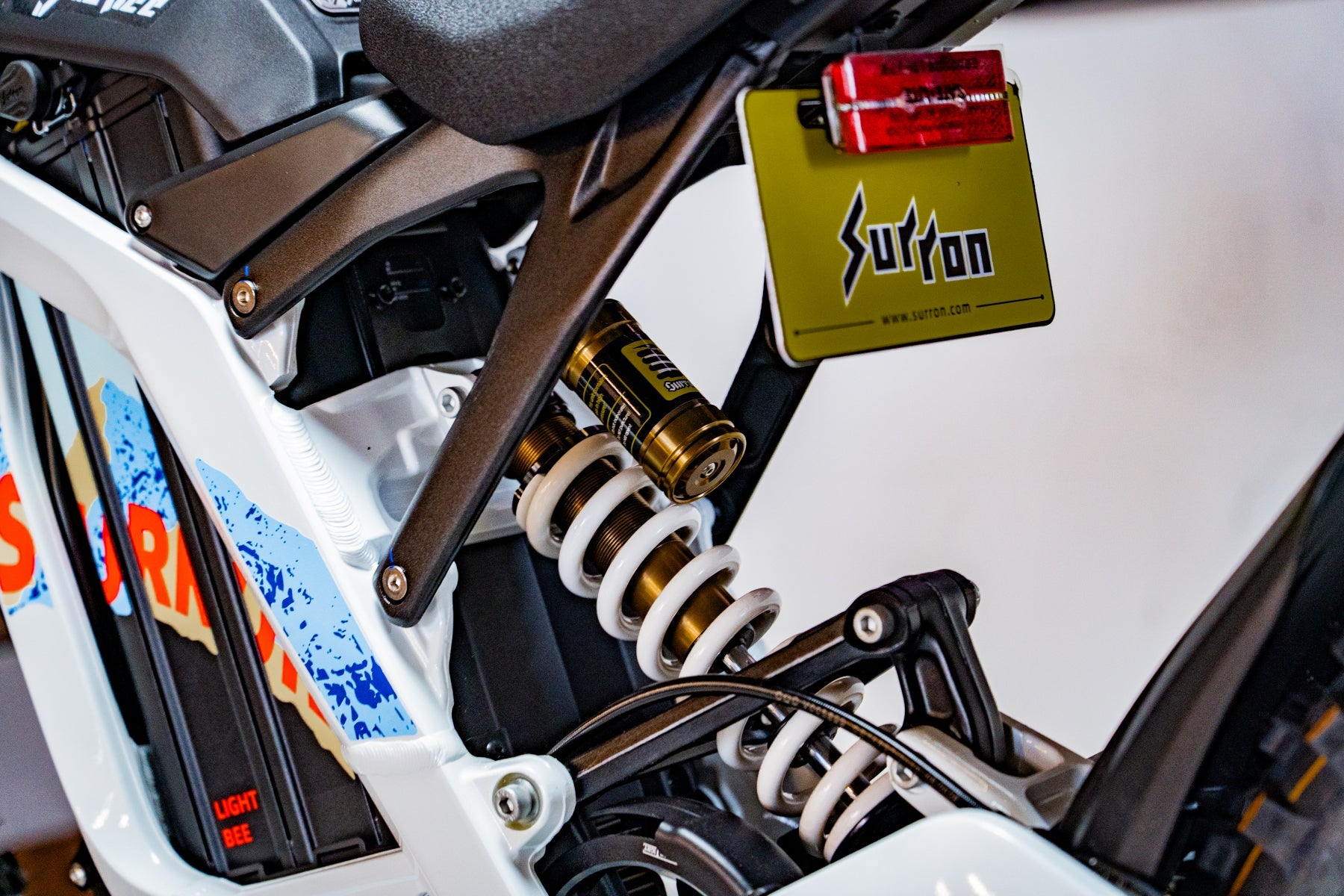 SURRON Light Bee X 2026 electric dirt bike in white, motor and frame detail
