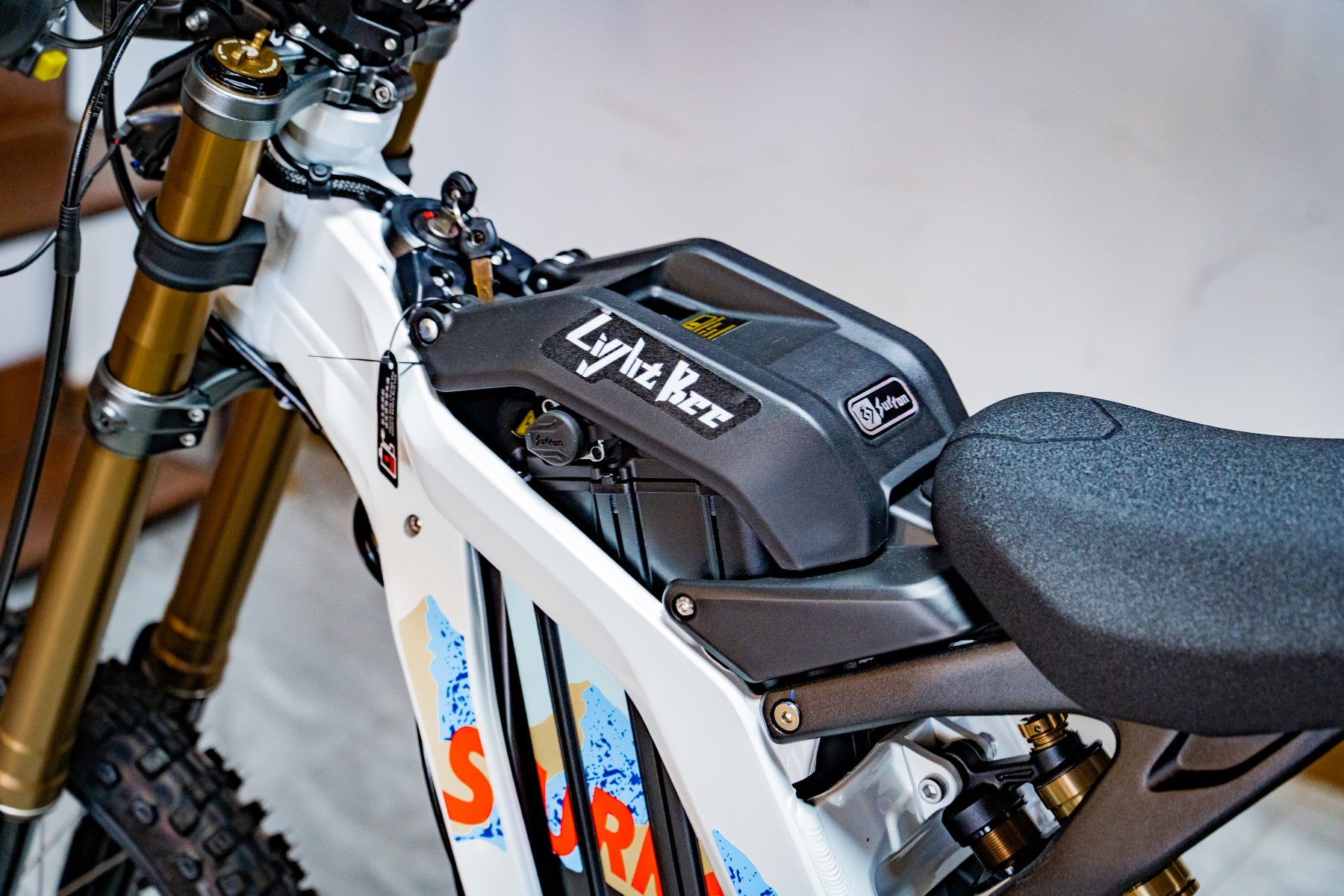 SURRON Light Bee X 2026 electric dirt bike in white, wheel and tyre detail