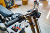 SURRON Light Bee X 2026 electric dirt bike in white, swingarm and drive detail