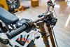 SURRON Light Bee X 2026 electric dirt bike in white, swingarm and drive detail