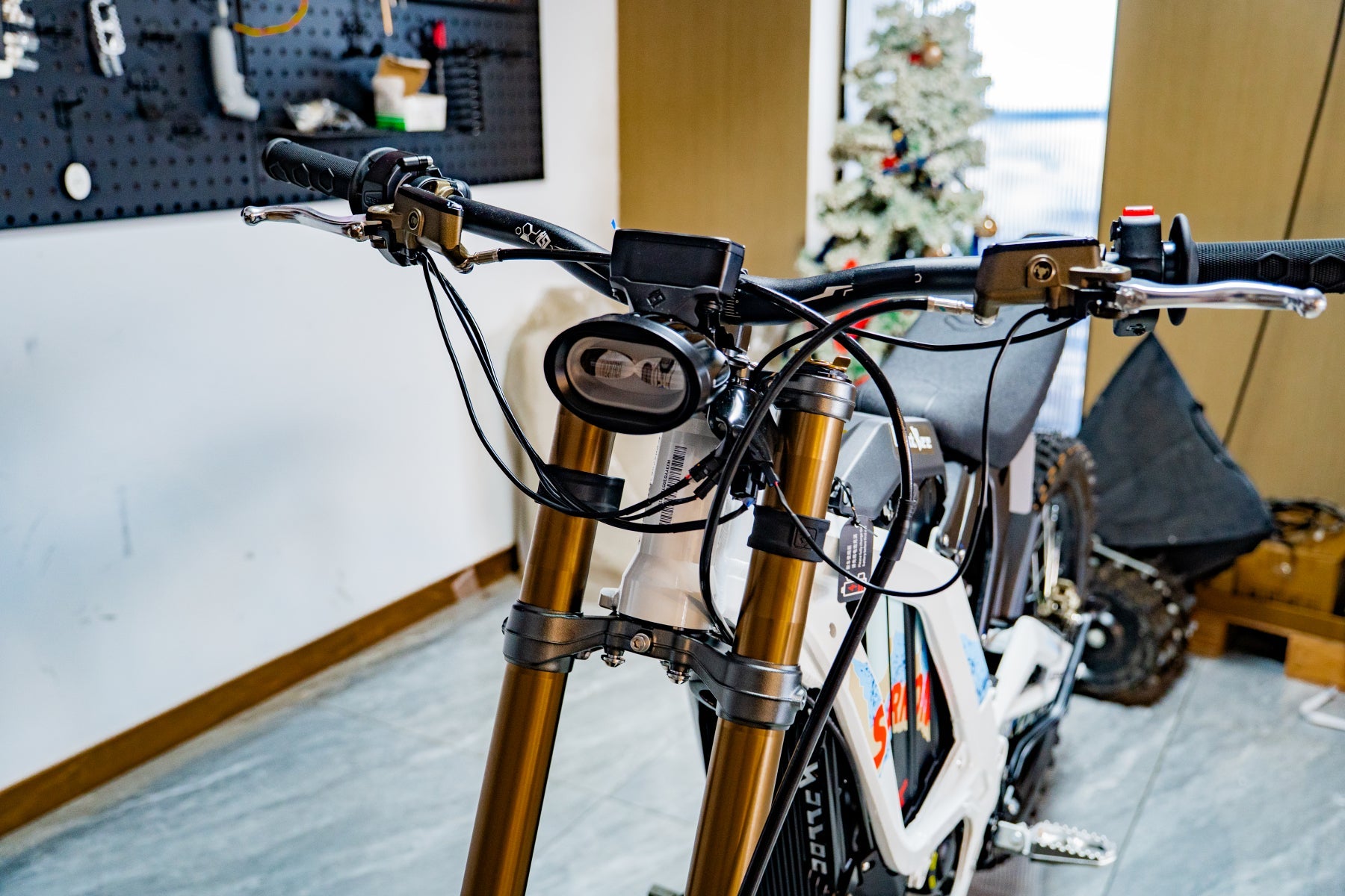 SURRON Light Bee X 2026 electric dirt bike in white, front fork detail