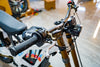 SURRON Light Bee X 2026 electric dirt bike in white, swingarm and drive detail